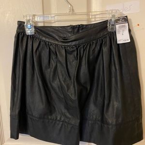 Black artificial leather mini.